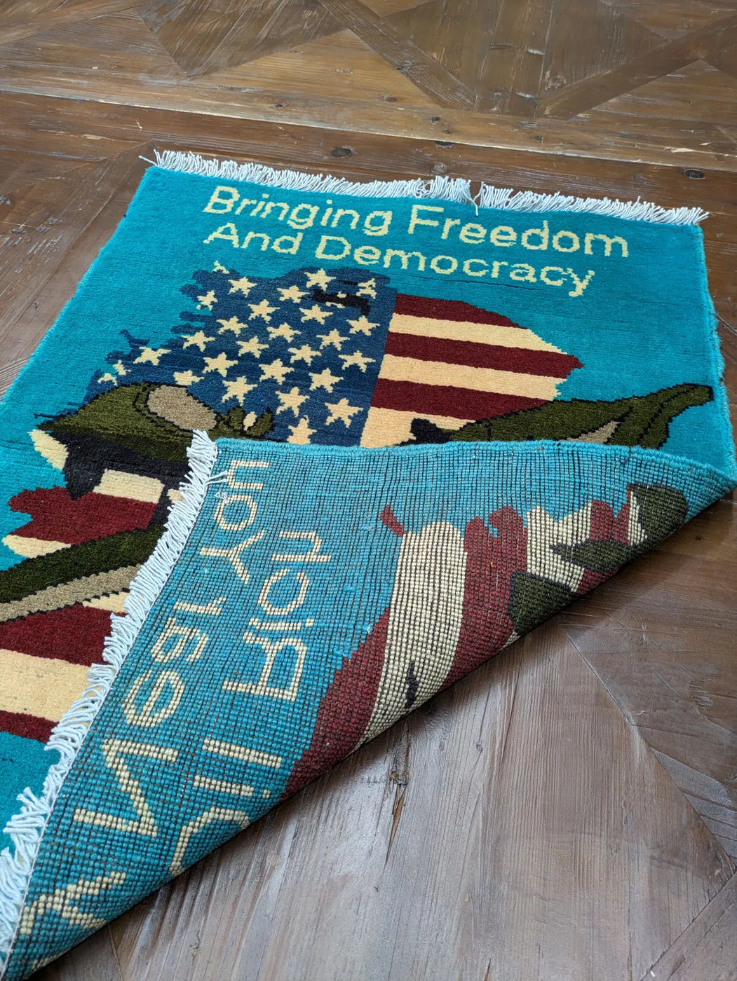 Afghan War Rug #2000: turquoise, with a US flag, aircraft and Bringing Freedom And Democracy, 80 x 60 cm, photo 5 of 8