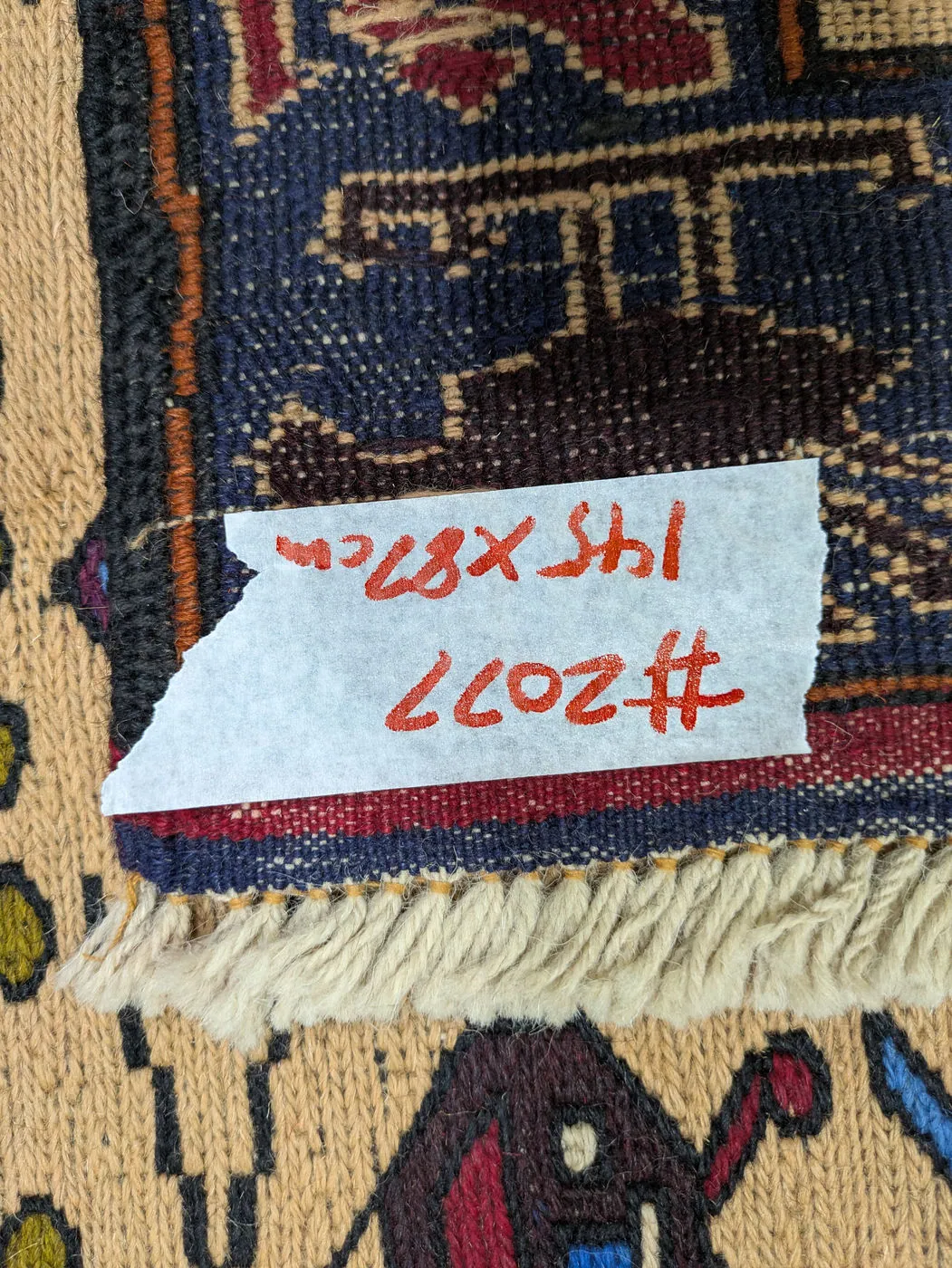 Afghan War Rug #2077: beige, with helicopters, tanks and rows of vehicles, 145 x 87 cm, photo 8 of 8, the tag on the back
