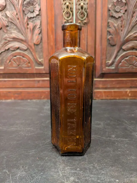 Antique Australian Poison Bottle, Amber Hex “NOT TO BE TAKEN", AGM c.1910 to 1920