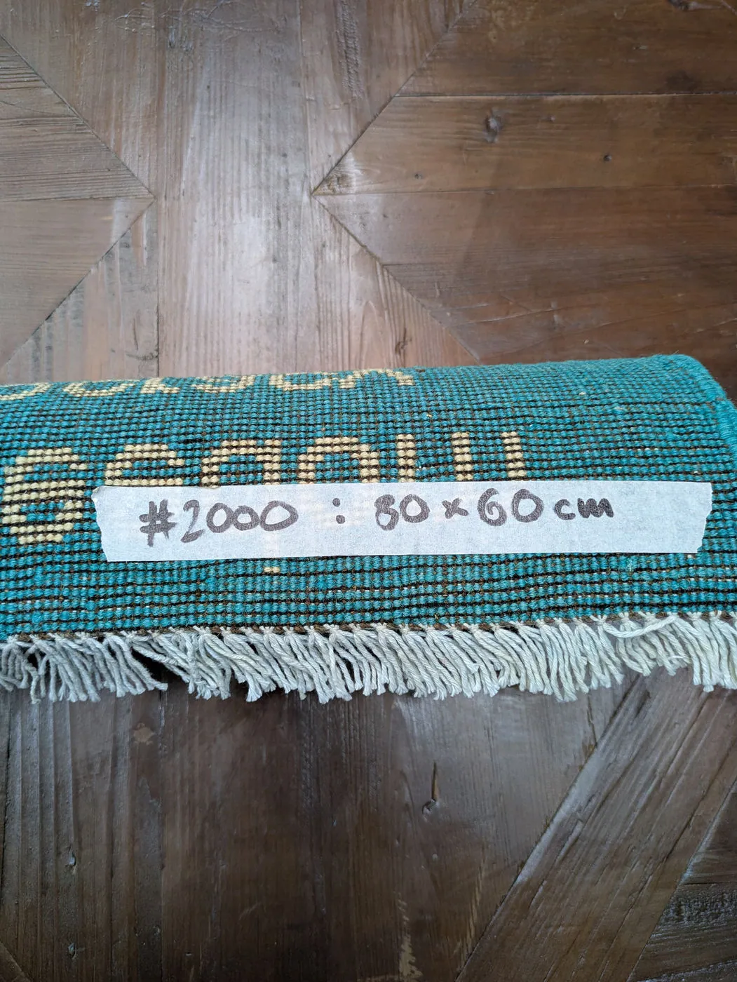 Afghan War Rug #2000: turquoise, with a US flag, aircraft and Bringing Freedom And Democracy, 80 x 60 cm, photo 8 of 8, the tag on the back