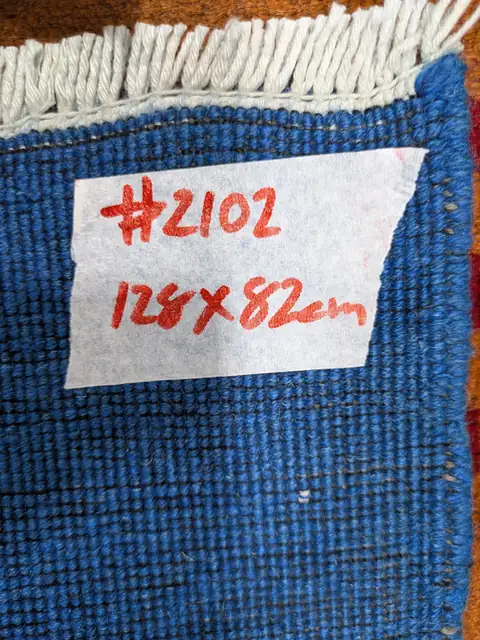 The back of rug 2102 with its size tag