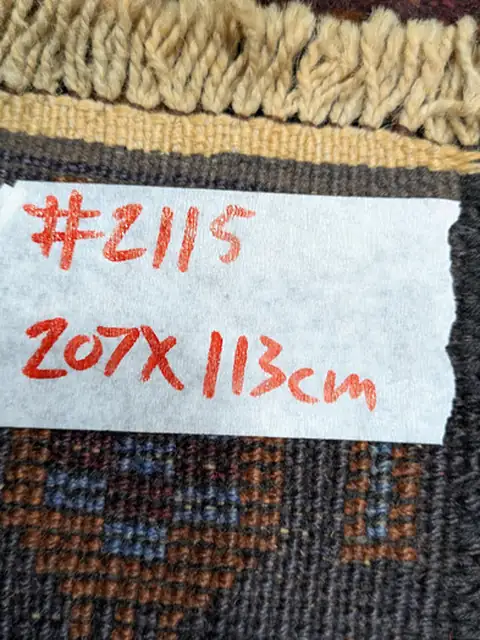 The back of rug 2115 with its size tag